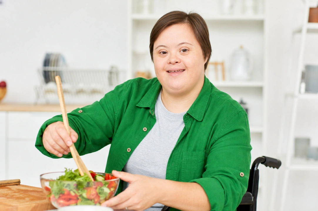 Adult with an intellectual disability cooking independently at home with light in-home support